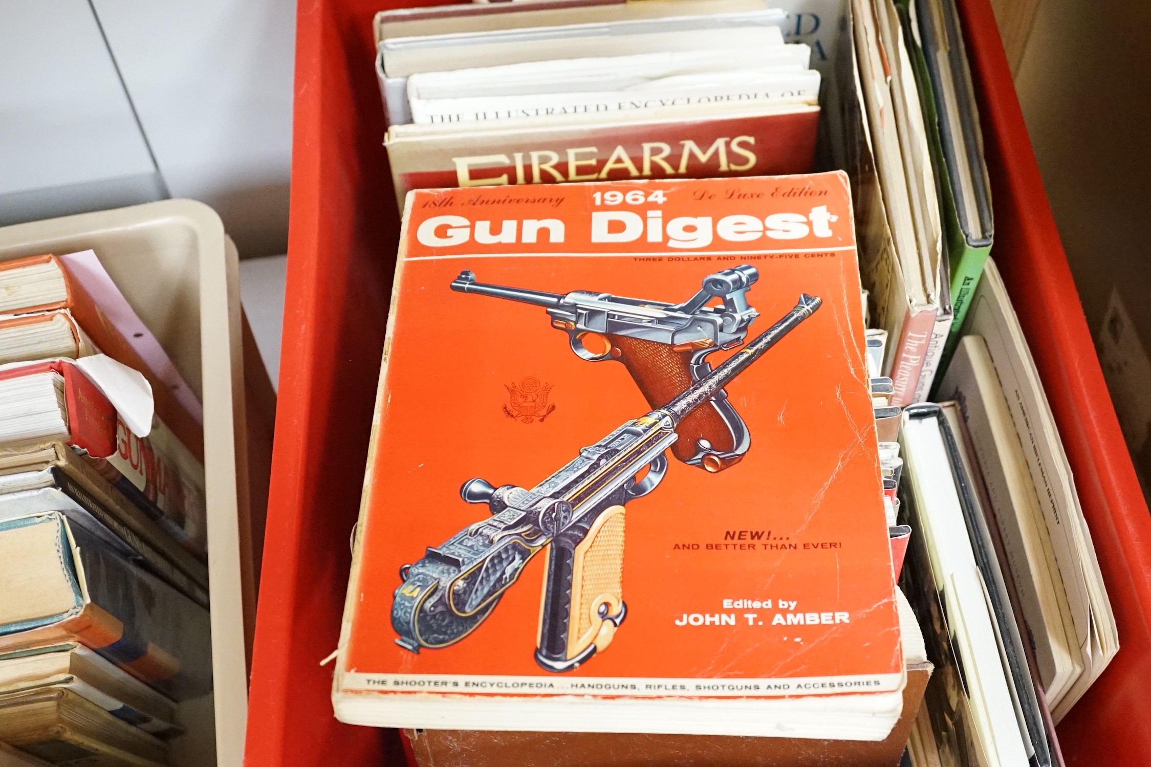 A quantity of reference books on weapons